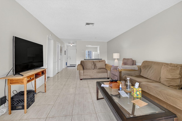 13984 Via Flora Unit B, Delray Beach, FL 33484 - living area with light tile patterned floors and a textured ceiling
