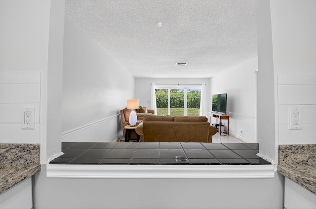 13984 Via Flora Unit B, Delray Beach, FL 33484 - living area with a textured ceiling