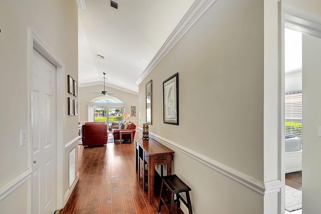 1738 Barnstable Rd, Wellington, FL 33414 - hallway featuring vaulted ceiling, crown molding, and dark wood-style flooring