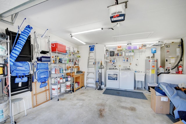1738 Barnstable Rd, Wellington, FL 33414 - garage featuring washing machine and clothes dryer, water heater, heating unit, and a garage door opener