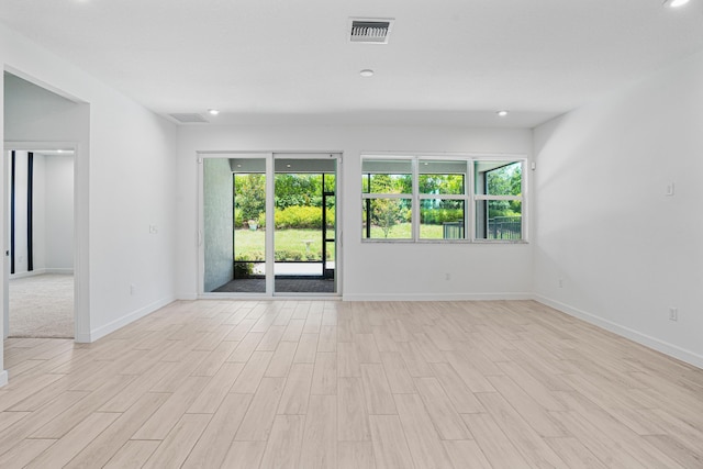 11687 SW Viridian Blvd, Port Saint Lucie, FL 34987 - unfurnished room featuring healthy amount of natural light, light wood-style floors, and recessed lighting