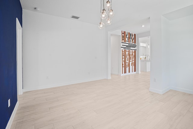 11687 SW Viridian Blvd, Port Saint Lucie, FL 34987 - unfurnished room featuring light wood finished floors and a smoke detector
