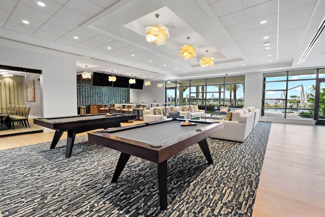 11687 SW Viridian Blvd, Port Saint Lucie, FL 34987 - recreation room with a tray ceiling, billiards, wood finished floors, and recessed lighting