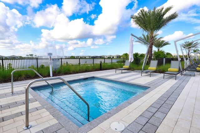 11687 SW Viridian Blvd, Port Saint Lucie, FL 34987 - view of swimming pool with a swimming pool and a patio area