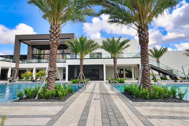 11687 SW Viridian Blvd, Port Saint Lucie, FL 34987 - view of property featuring stairs and a community pool