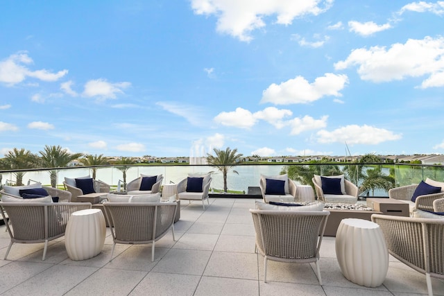 11687 SW Viridian Blvd, Port Saint Lucie, FL 34987 - view of patio with an outdoor living space with a fire pit and a water view