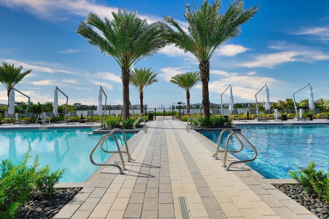 11687 SW Viridian Blvd, Port Saint Lucie, FL 34987 - community pool featuring a patio