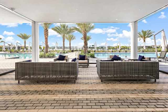 11687 SW Viridian Blvd, Port Saint Lucie, FL 34987 - view of patio featuring an outdoor hangout area and a community pool