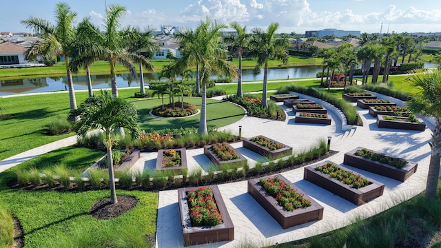 11687 SW Viridian Blvd, Port Saint Lucie, FL 34987 - surrounding community featuring a water view, a lawn, a garden, and a residential view