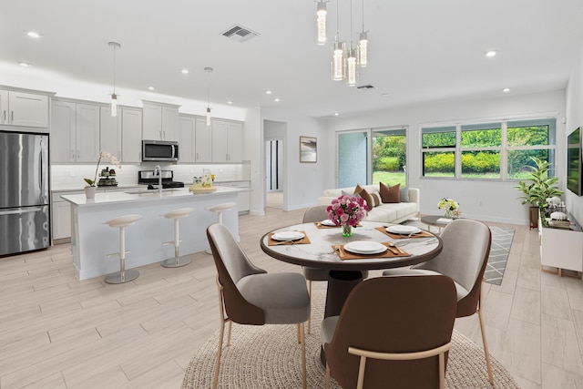 11687 SW Viridian Blvd, Port Saint Lucie, FL 34987 - dining area with recessed lighting and light wood-style flooring