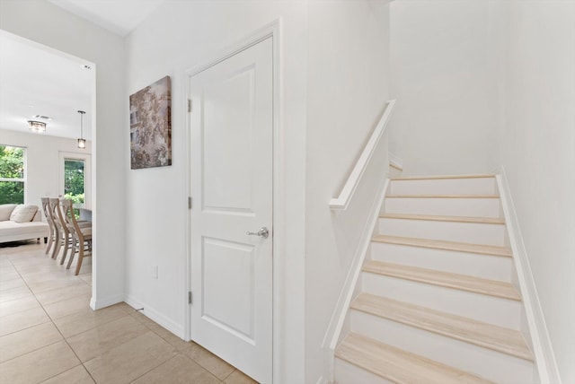6161 Rancho Ln, West Palm Beach, FL 33415 - staircase with tile patterned flooring and baseboards