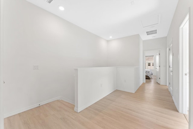 6161 Rancho Ln, West Palm Beach, FL 33415 - hall with light wood finished floors, attic access, and an upstairs landing