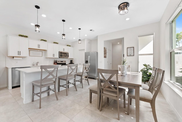 6161 Rancho Ln, West Palm Beach, FL 33415 - dining area with recessed lighting and light tile patterned floors