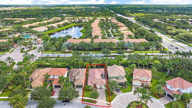 12025 Aviles Cir, Palm Beach Gardens, FL 33418 - aerial perspective of suburban area featuring property boundaries highlighted and a large body of water