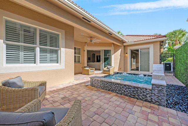 12025 Aviles Cir, Palm Beach Gardens, FL 33418 - view of patio featuring a ceiling fan, a jacuzzi, and an outdoor hangout area