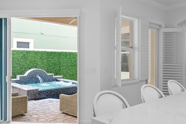 12025 Aviles Cir, Palm Beach Gardens, FL 33418 - exterior space featuring crown molding, brick floors, and a ceiling fan