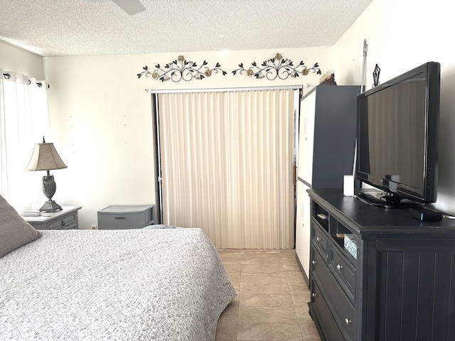 5807 Parkwalk Dr Unit 1124, Boynton Beach, FL 33472 - bedroom with a textured ceiling and light tile patterned floors