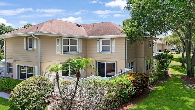 4604 Roxbury Ct, Boynton Beach, FL 33436 - back of house with a lawn and a shingled roof