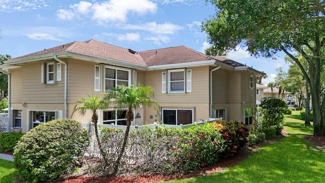 4604 Roxbury Ct, Boynton Beach, FL 33436 - rear view of property with a lawn