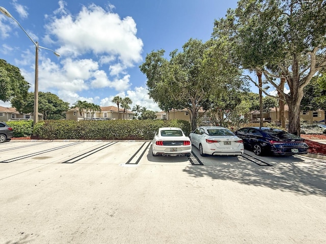 4604 Roxbury Ct, Boynton Beach, FL 33436 - uncovered parking lot featuring a residential view