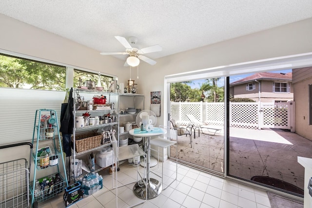 4604 Roxbury Ct, Boynton Beach, FL 33436 - dining room with plenty of natural light, ceiling fan, a textured ceiling, and tile patterned floors