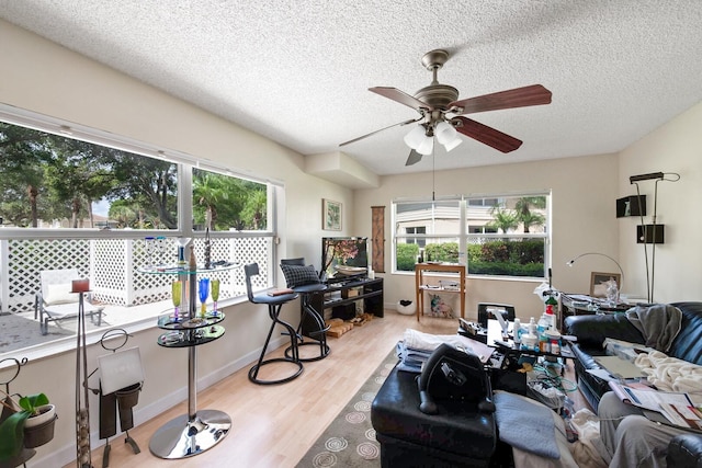 4604 Roxbury Ct, Boynton Beach, FL 33436 - living area with wood finished floors, ceiling fan, and a textured ceiling