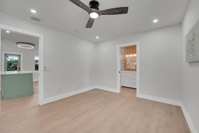 950 York St, West Palm Beach, FL 33401 - empty room featuring light wood-style floors, a ceiling fan, and recessed lighting