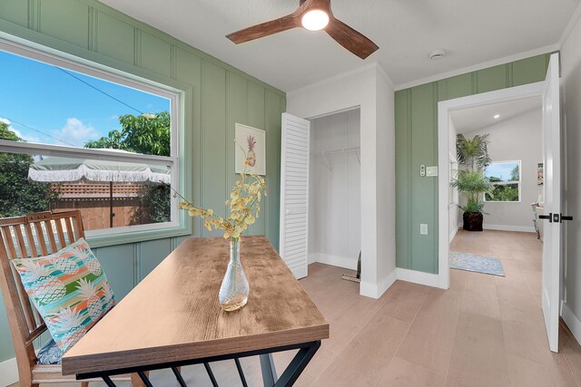 950 York St, West Palm Beach, FL 33401 - office space with healthy amount of natural light, crown molding, a ceiling fan, and a decorative wall