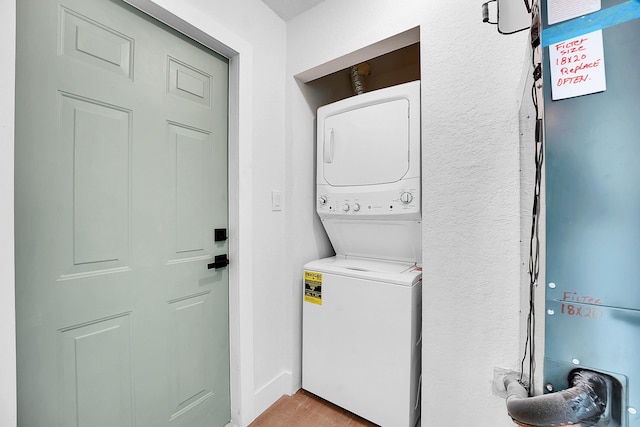 950 York St, West Palm Beach, FL 33401 - laundry room with estacked washer and dryer and light wood-type flooring