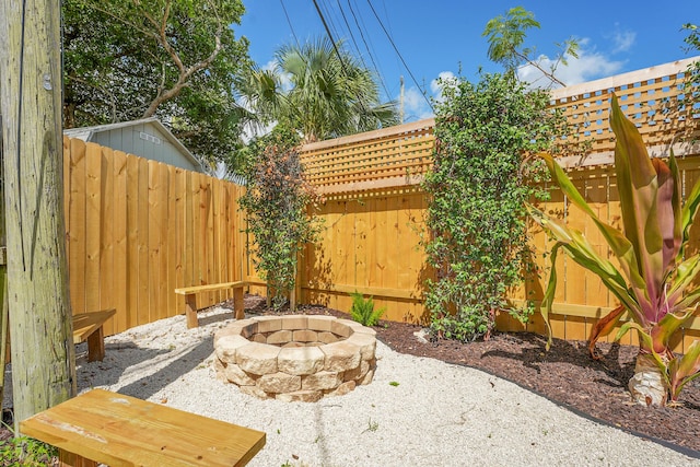 950 York St, West Palm Beach, FL 33401 - fenced backyard featuring an outdoor fire pit and a patio area