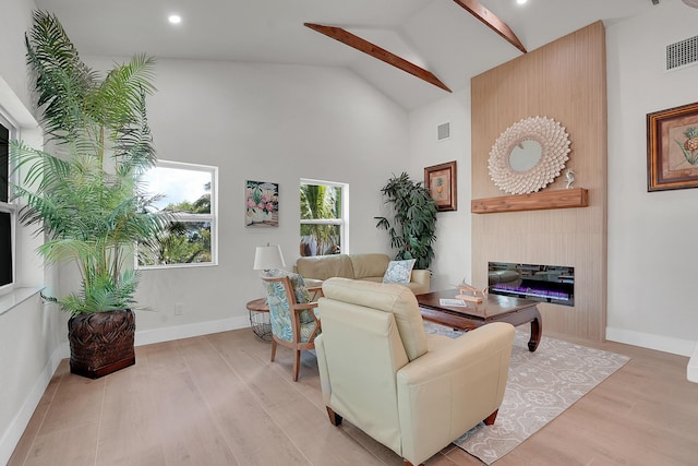 950 York St, West Palm Beach, FL 33401 - living area with light wood-type flooring, a large fireplace, high vaulted ceiling, and recessed lighting