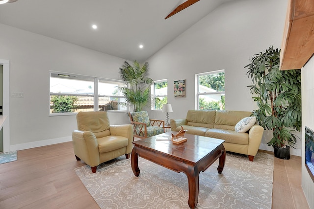 950 York St, West Palm Beach, FL 33401 - living room featuring high vaulted ceiling, light wood finished floors, healthy amount of natural light, and recessed lighting