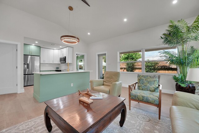 950 York St, West Palm Beach, FL 33401 - dining area featuring lofted ceiling, light wood-style flooring, and recessed lighting