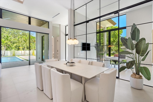 2265 NE 30th Ct, Lighthouse Point, FL 33064 - dining room featuring a towering ceiling