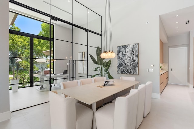 2265 NE 30th Ct, Lighthouse Point, FL 33064 - dining space with a towering ceiling and expansive windows