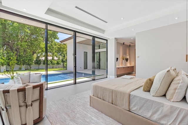 2265 NE 30th Ct, Lighthouse Point, FL 33064 - bedroom with finished concrete flooring, access to outside, a wall of windows, recessed lighting, and ensuite bath