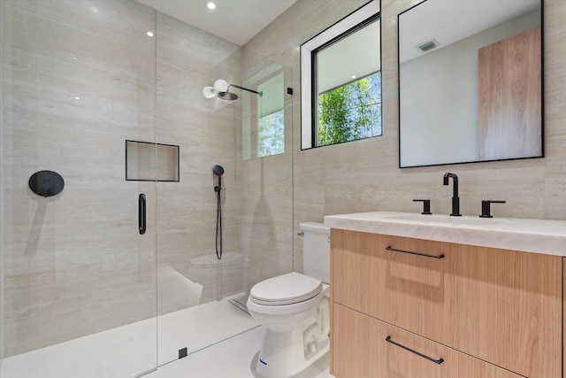 2265 NE 30th Ct, Lighthouse Point, FL 33064 - bathroom featuring tile walls, a shower stall, and vanity