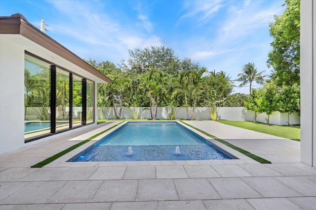 2265 NE 30th Ct, Lighthouse Point, FL 33064 - view of pool featuring a fenced backyard and a patio