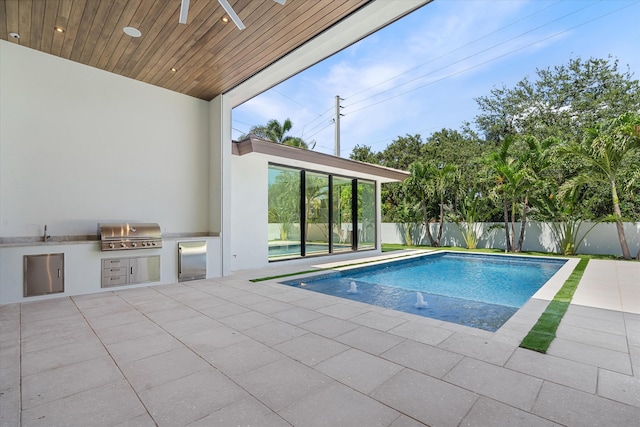 2265 NE 30th Ct, Lighthouse Point, FL 33064 - view of pool with exterior kitchen, a patio area, and ceiling fan