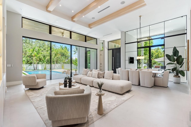 2265 NE 30th Ct, Lighthouse Point, FL 33064 - living area featuring beamed ceiling, healthy amount of natural light, and a high ceiling