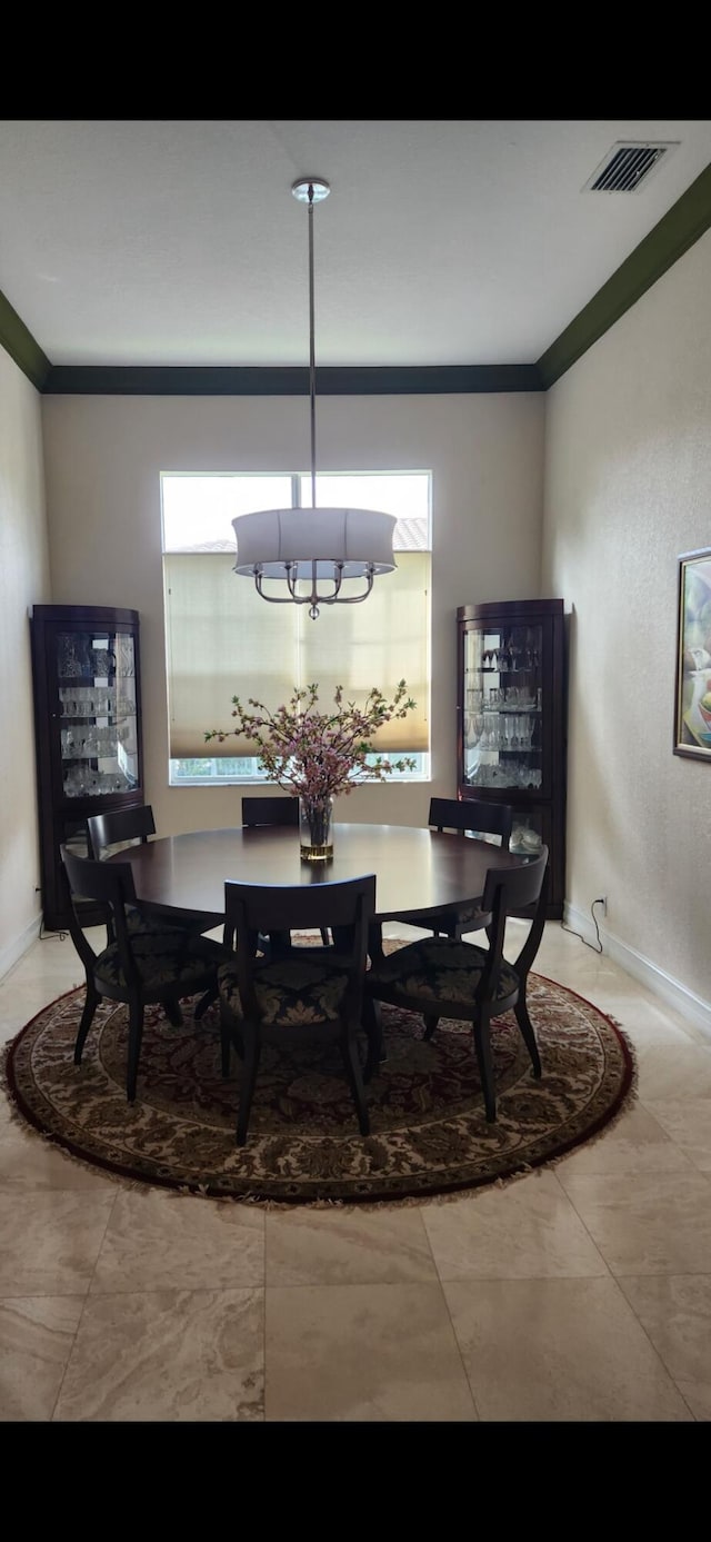 8045 NW 109th Ln, Parkland, FL 33076 - dining area featuring crown molding and baseboards