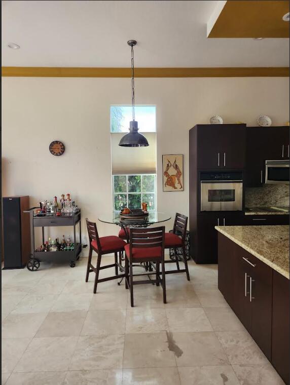 8045 NW 109th Ln, Parkland, FL 33076 - dining room with light tile patterned flooring