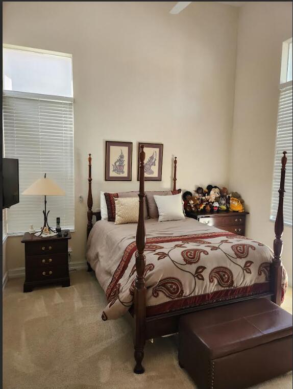 8045 NW 109th Ln, Parkland, FL 33076 - carpeted bedroom featuring baseboards