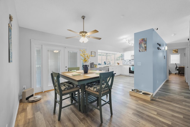 356 SW Grimaldo Ter, Port Saint Lucie, FL 34984 - dining area with light wood-style floors, french doors, ceiling fan, and vaulted ceiling