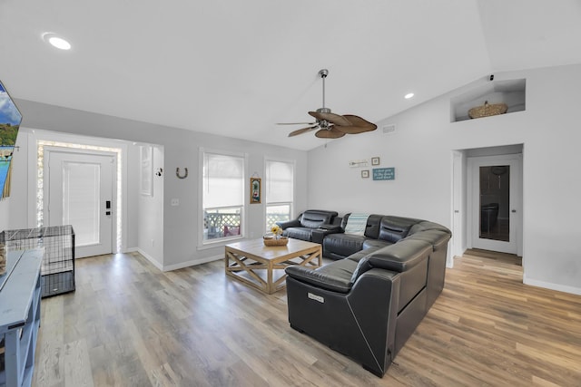 356 SW Grimaldo Ter, Port Saint Lucie, FL 34984 - living room with lofted ceiling, a ceiling fan, light wood-type flooring, and recessed lighting