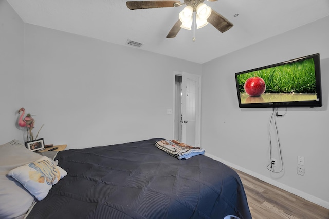 356 SW Grimaldo Ter, Port Saint Lucie, FL 34984 - bedroom featuring wood finished floors and a ceiling fan