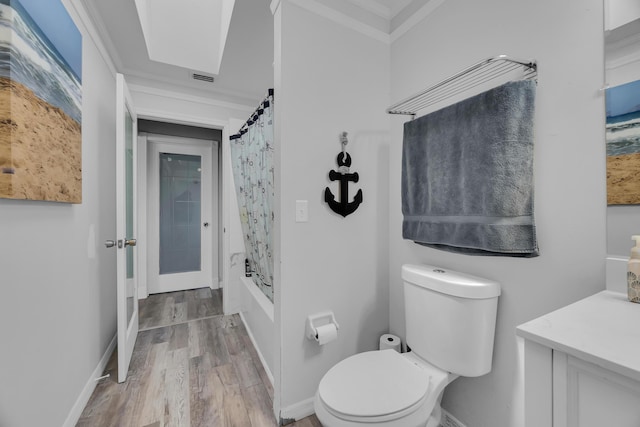 356 SW Grimaldo Ter, Port Saint Lucie, FL 34984 - bathroom featuring crown molding, wood finished floors, vanity, and shower / bath combo with shower curtain