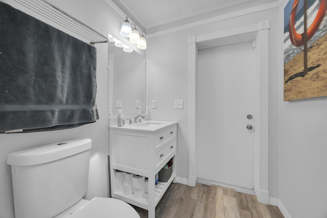 356 SW Grimaldo Ter, Port Saint Lucie, FL 34984 - bathroom with wood finished floors, vanity, and ornamental molding