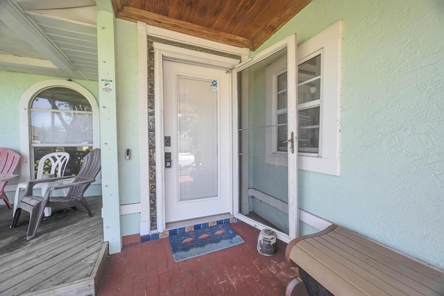 356 SW Grimaldo Ter, Port Saint Lucie, FL 34984 - doorway to property featuring stucco siding and covered porch