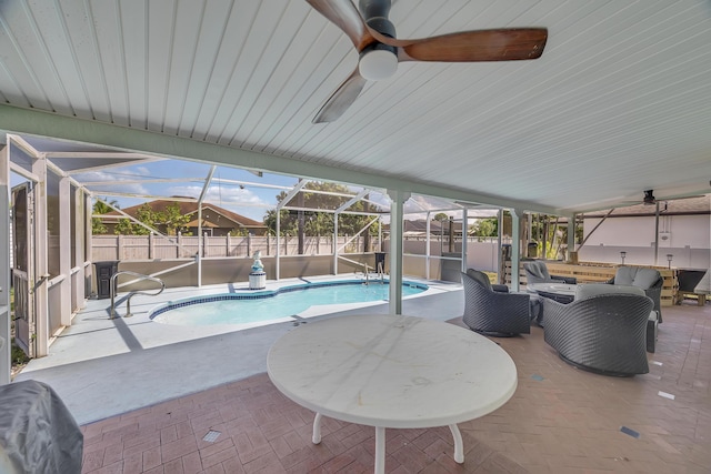 356 SW Grimaldo Ter, Port Saint Lucie, FL 34984 - view of swimming pool featuring a fenced backyard, a patio, glass enclosure, and ceiling fan
